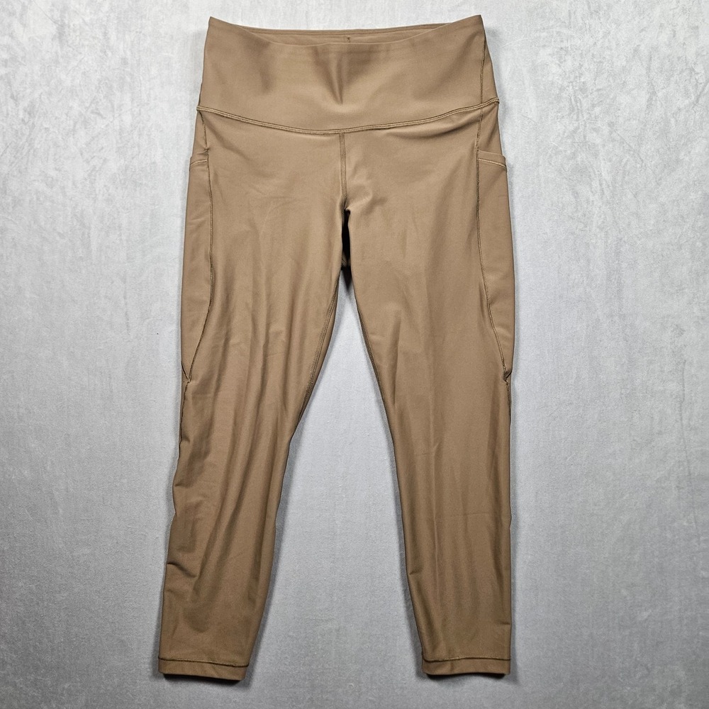 Athleta Interval Stash Lasercut 7/8 Tight Leggings Womens Brown Large Pockets